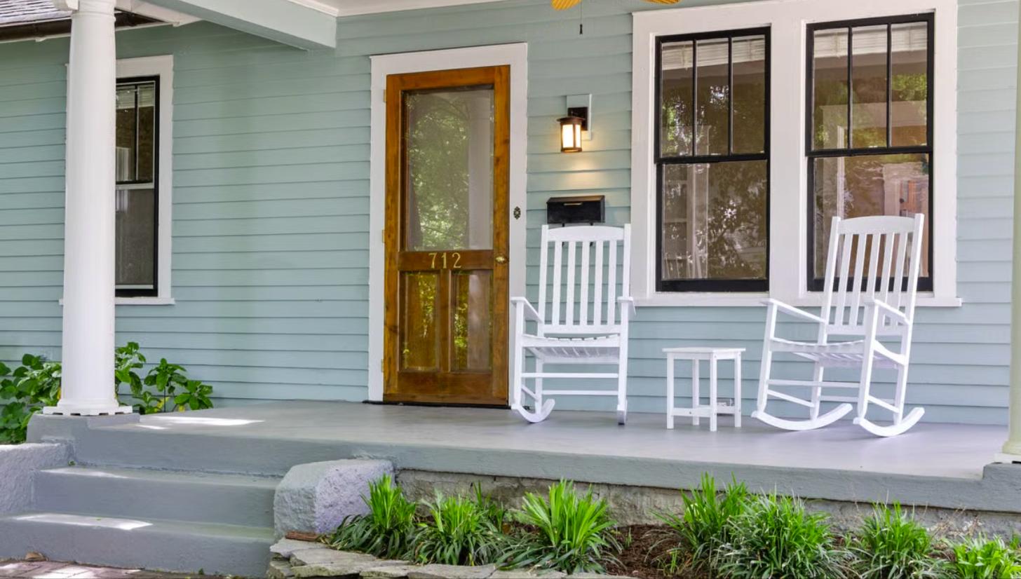 Cozy front porch with white rocking chairs